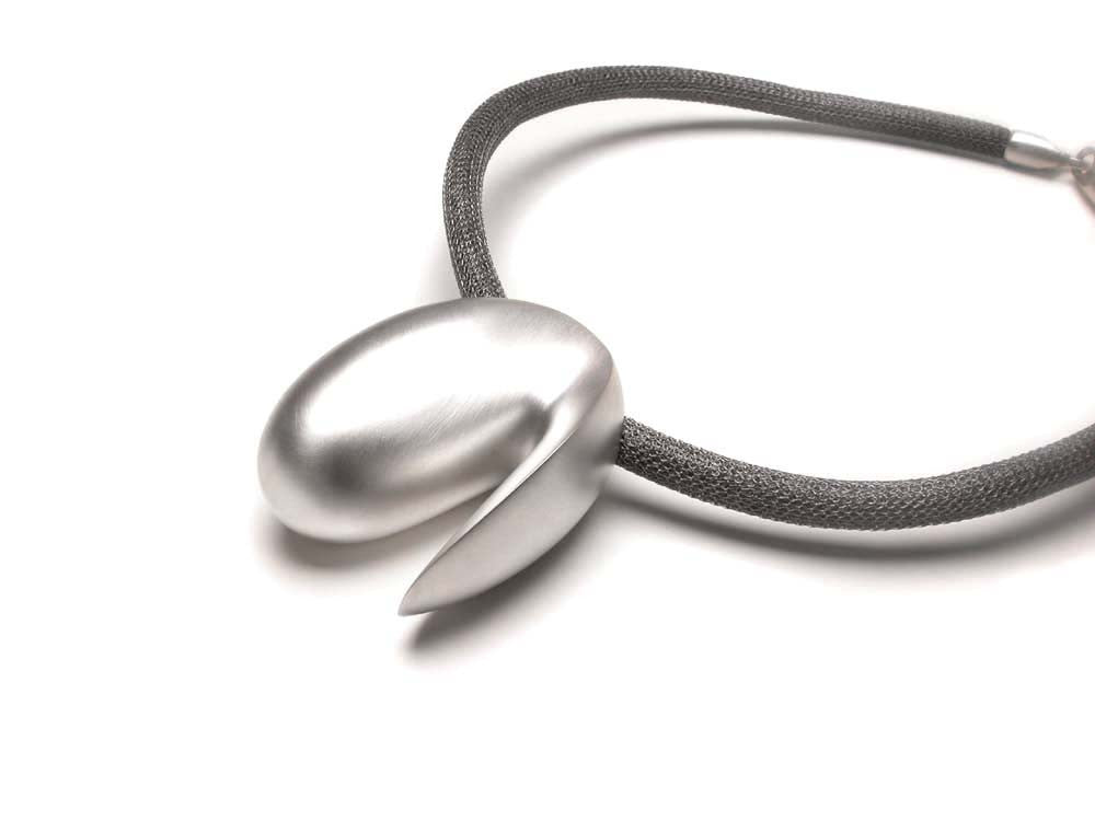 Wearable sculpture pendant in sterling silver on a grey mesh or black silk cord. Satin matte or highly polished finish. $1,890.00