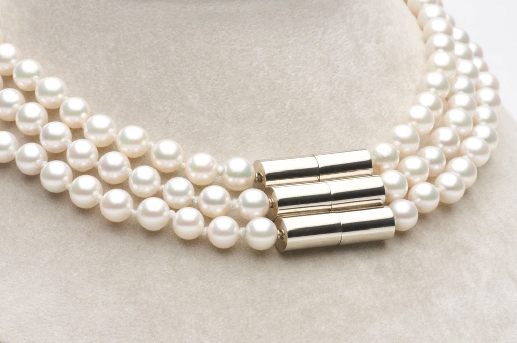 Beautiful, lustrous Japanese Cultured Pearls. Three strand necklace, 7.5mm, 18 karat white gold triple magnetic clasp. Custom work. Price inquiry. $0.00