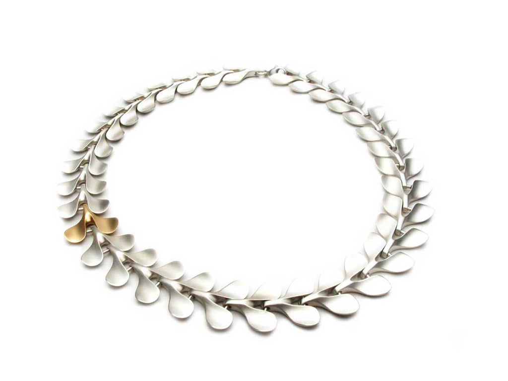 THE LEAF necklace in sterling silver with one element in eighteen karat gold. $2,990.00