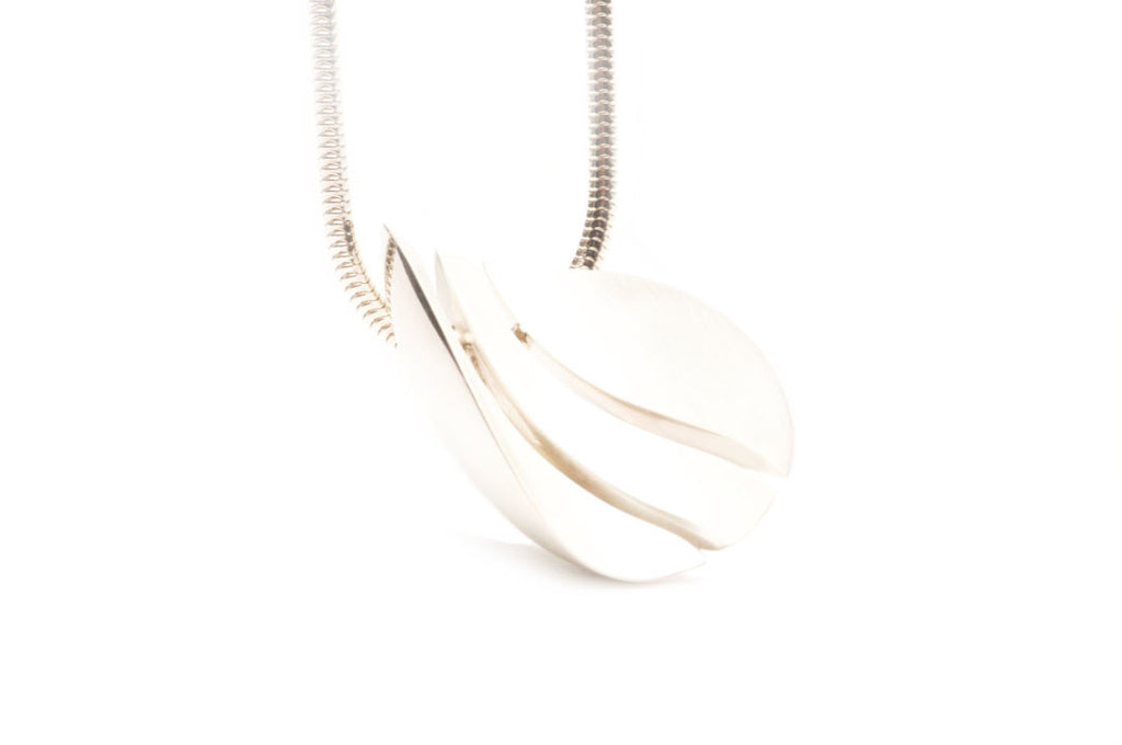 Satin matte sterling silver pendant on a sterling silver chain. $650.00