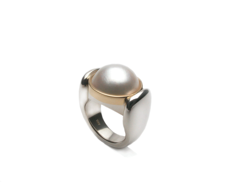 White Mabe pearl set in eighteen karat gold and sterling silver. Price inquiry. $0.00