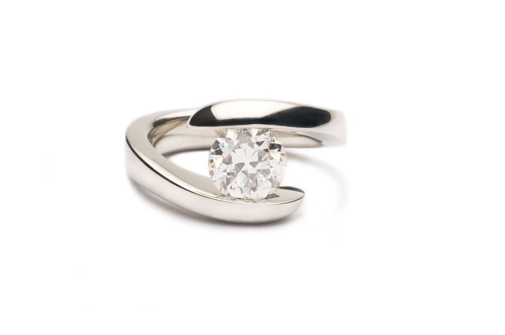 Custom-made Pressure-set Natural Diamond in the eighteen karat White Gold tension ring.
Order yours Today! Price varies with the size and quality of the diamond.
  $0.00