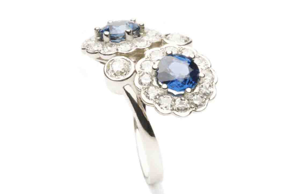 Commissioned Ring in eighteen karat white gold holding 2 Sapphires and 26 Diamonds. It is the exact replica of a more than one hundred years old family ring.
Naturally, we make traditional and classic jewellery as well! 
Price inquiry. $0.00