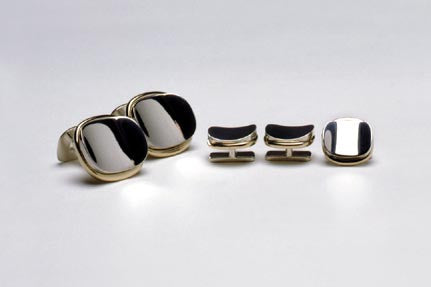 Cuff-links in sterling silver and eighteen karat gold. Shown with matching Tuxedo studs TS003. $595.00